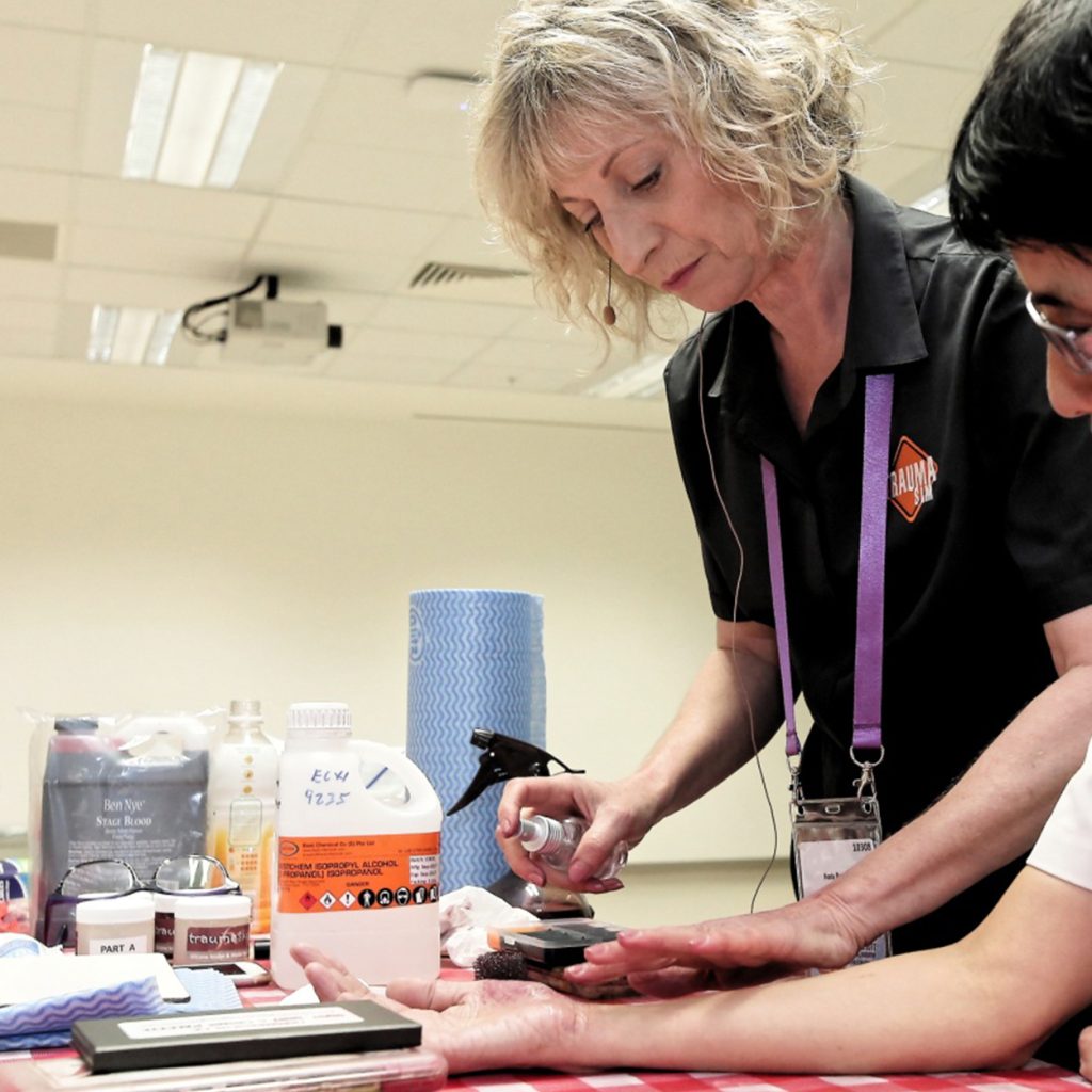 TraumaSim moulage technician preparing realistic trauma simulation